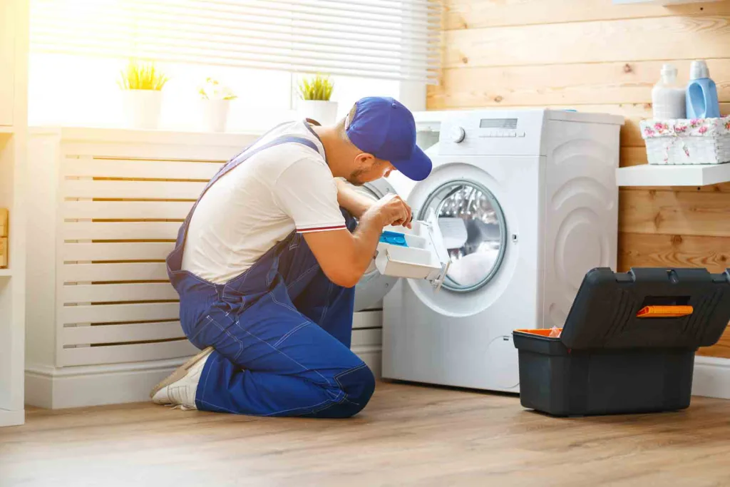 Technician repairing a washing machine